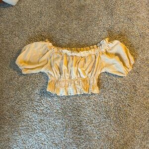 Crop top shirt more on the tan side, puffy sleeves and top.